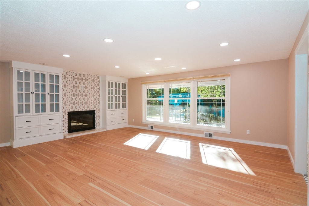 157 Captain Road Longmeadow, MA 01106 - Photo 7 of 41 a view of an empty room with window and fire place