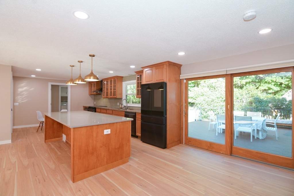 157 Captain Road Longmeadow, MA 01106 - Photo 9 of 41 a kitchen with stainless steel appliances granite countertop a refrigerator a sink and a stove top oven