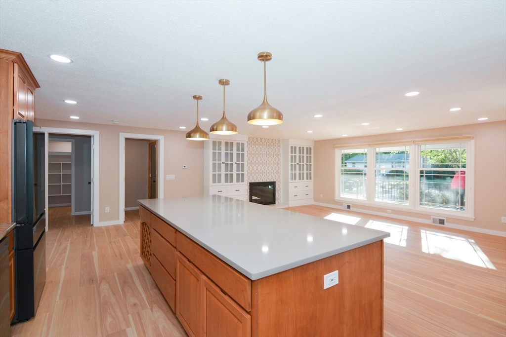 157 Captain Road Longmeadow, MA 01106 - Photo 10 of 41 a large kitchen with kitchen island a large island in it