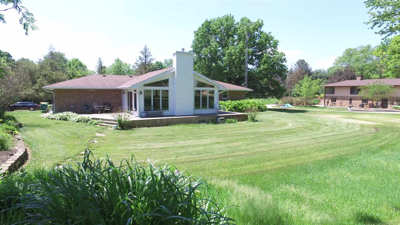 5701 Tipple Road Rockford, IL 61102 - Photo 20 of 21 a view of a house with a yard patio and fire pit
