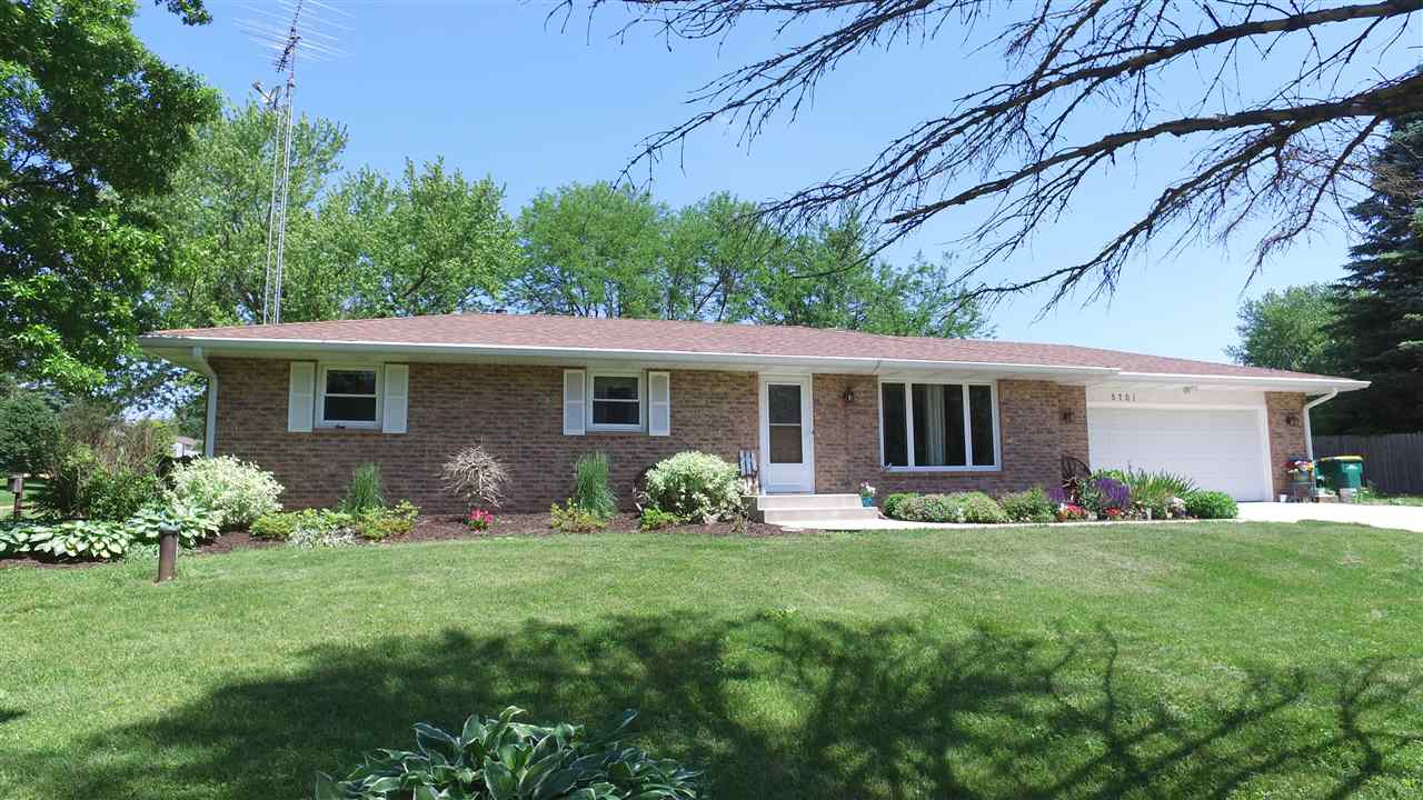 5701 Tipple Road Rockford, IL 61102 - Photo 3 of 21 a view of a house with a yard and garden