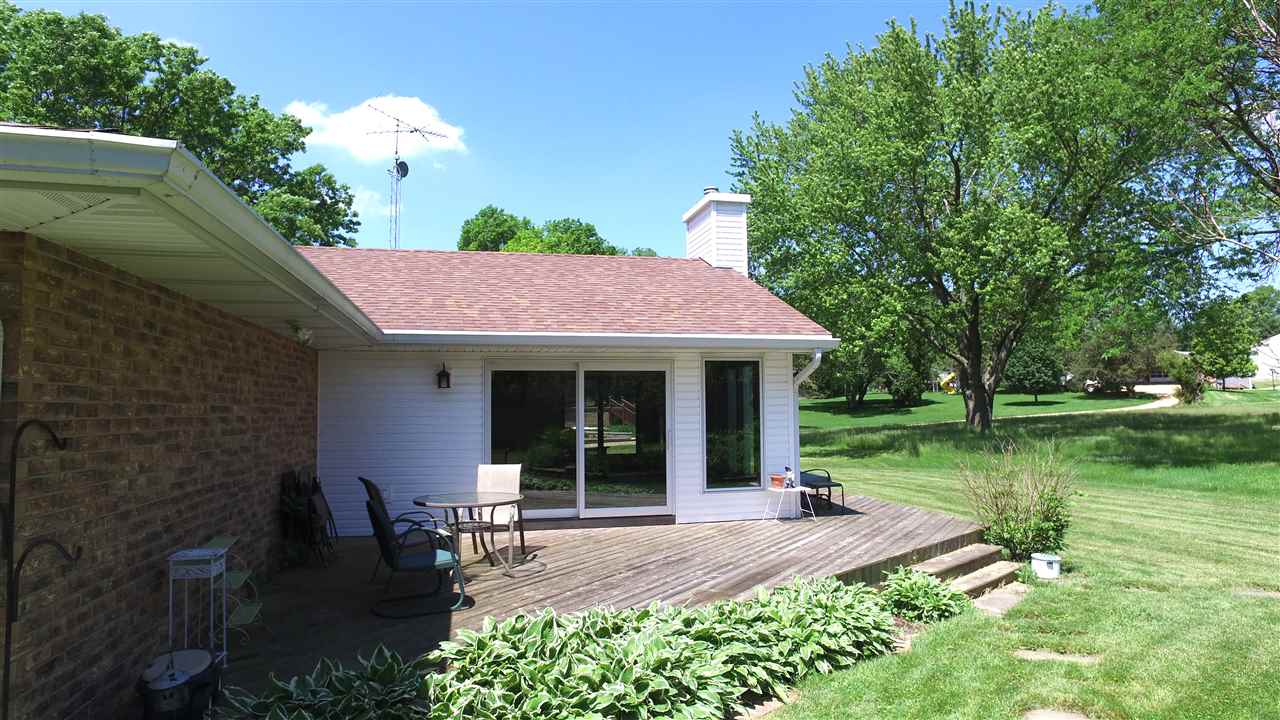 5701 Tipple Road Rockford, IL 61102 - Photo 5 of 21 a view of a chair and table in front of house