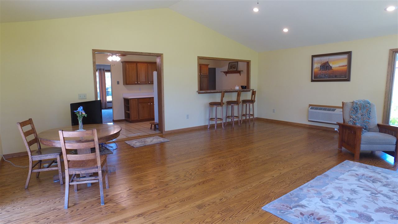 5701 Tipple Road Rockford, IL 61102 - Photo 7 of 21 a view of a dining room with furniture and wooden floor