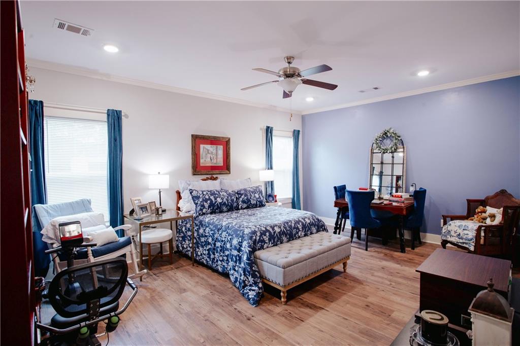 3221 Hollonville Road Williamson, GA 30292 - Photo 17 of 46 a bedroom with a bed gym equipment and a large window