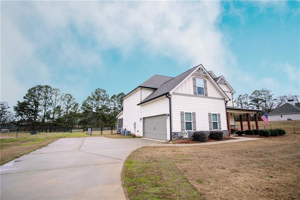3221 Hollonville Road Williamson, GA 30292 - Photo 2 of 46 a view of house with outdoor space and swimming pool