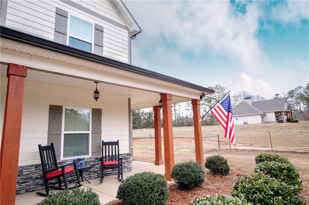 3221 Hollonville Road Williamson, GA 30292 - Photo 3 of 46 a front view of a house with outdoor space