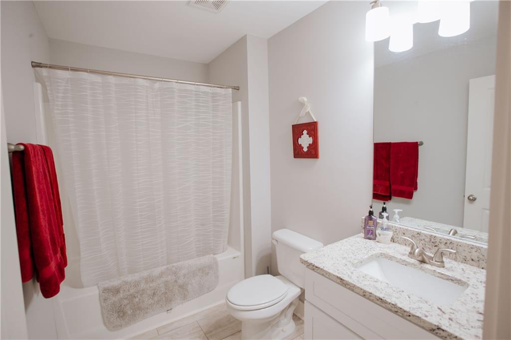 3221 Hollonville Road Williamson, GA 30292 - Photo 36 of 46 a bathroom with a sink a toilet and a shower