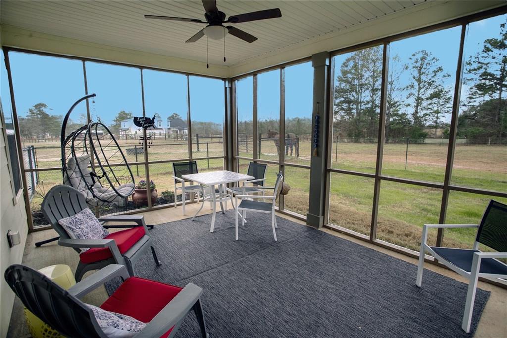 3221 Hollonville Road Williamson, GA 30292 - Photo 39 of 46 a living room with furniture and a floor to ceiling window