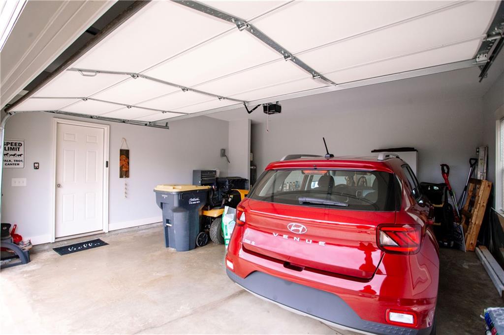 3221 Hollonville Road Williamson, GA 30292 - Photo 45 of 46 a bedroom with a bed and a mirror