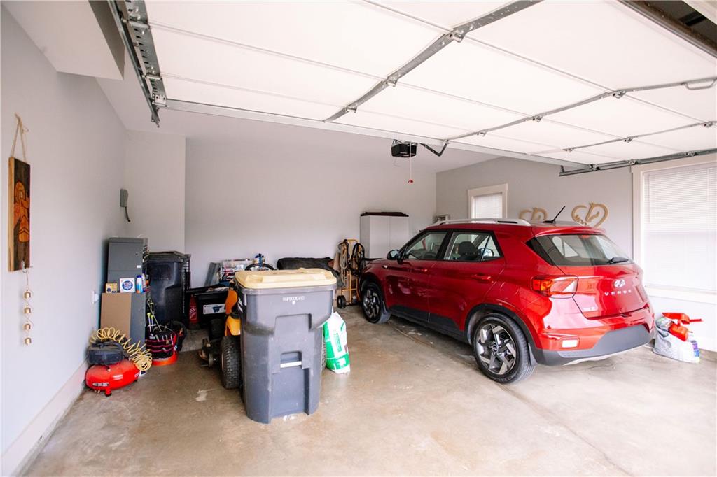 3221 Hollonville Road Williamson, GA 30292 - Photo 46 of 46 a car is parked in a garage