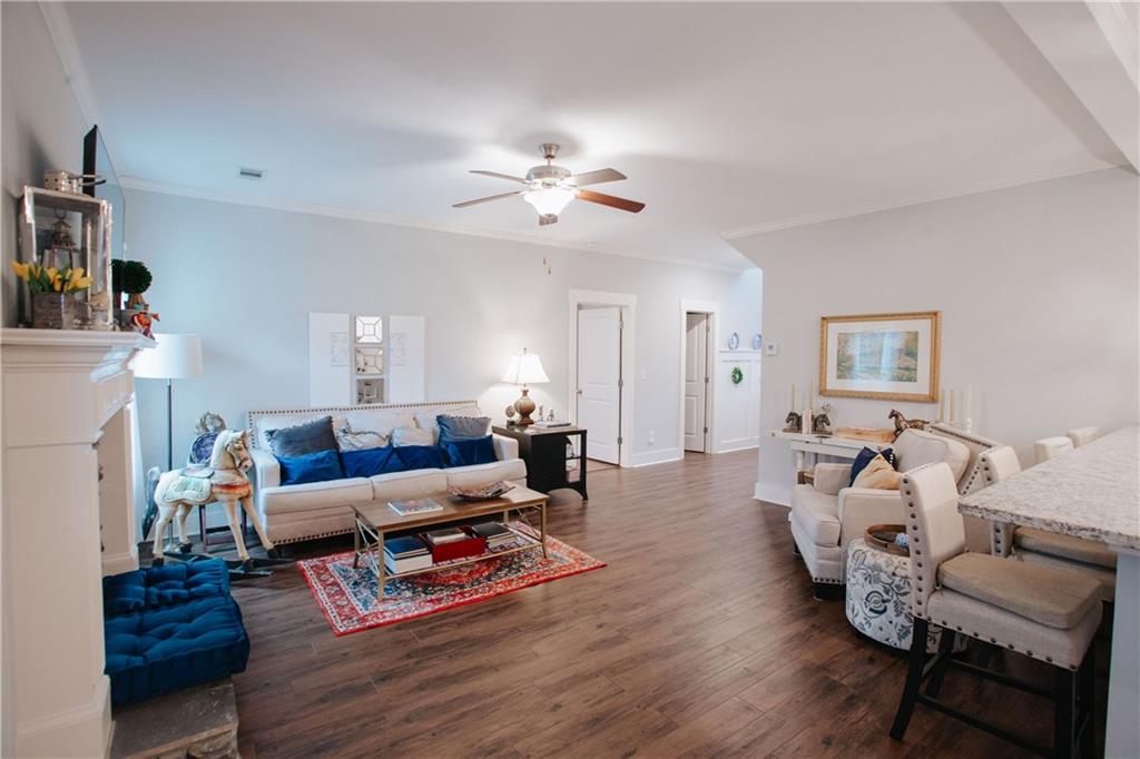 3221 Hollonville Road Williamson, GA 30292 - Photo 10 of 46 a living room with furniture or wooden floor and a ceiling fan