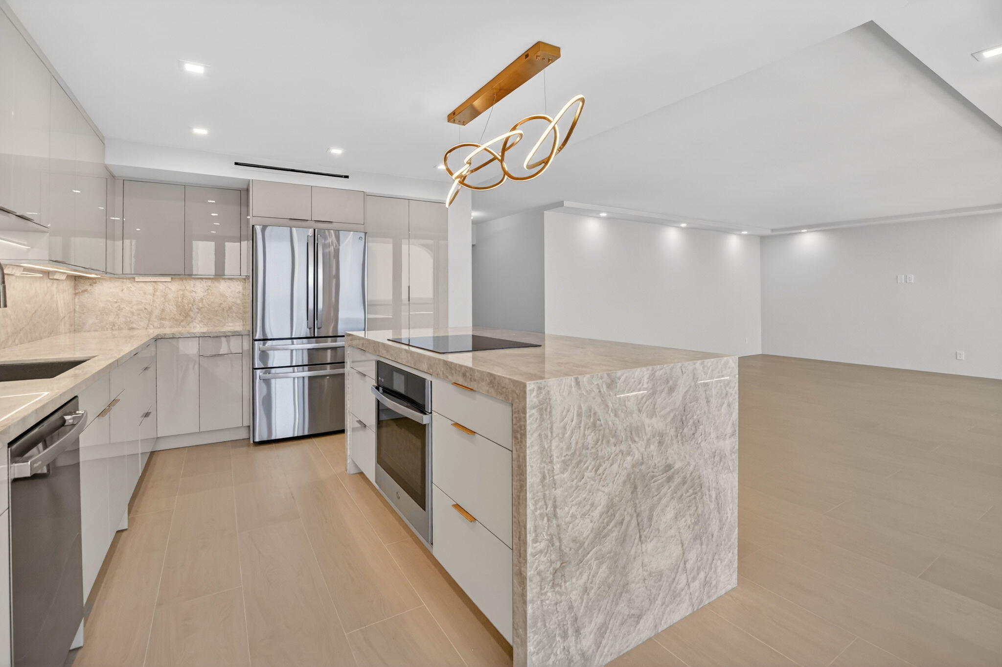 2800 South Ocean Boulevard, Unit 23C Boca Raton, FL 33432 - Photo 15 of 50 a kitchen with white cabinets and white appliances