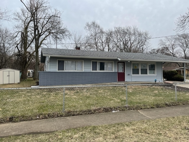 15303 Birch Road Markham, IL 60428 - Photo 2 of 12 a front view of a house with garden