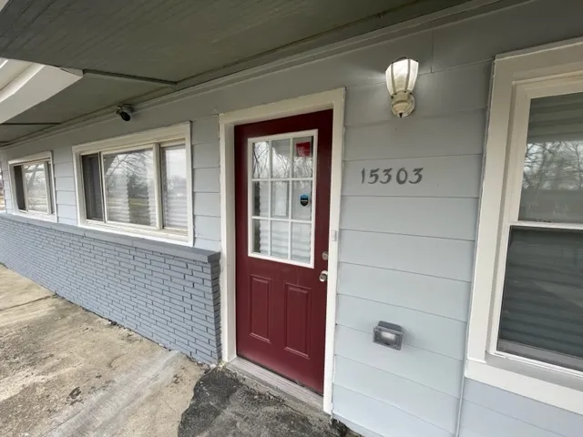 a kitchen with a sink cabinets and wooden floor