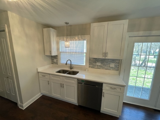 15303 Birch Road Markham, IL 60428 - Photo 5 of 12 a kitchen with a sink cabinets and wooden floor