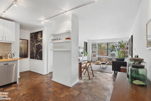 a view of a livingroom with furniture and hardwood floor