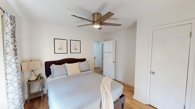 a bedroom with a bed and window