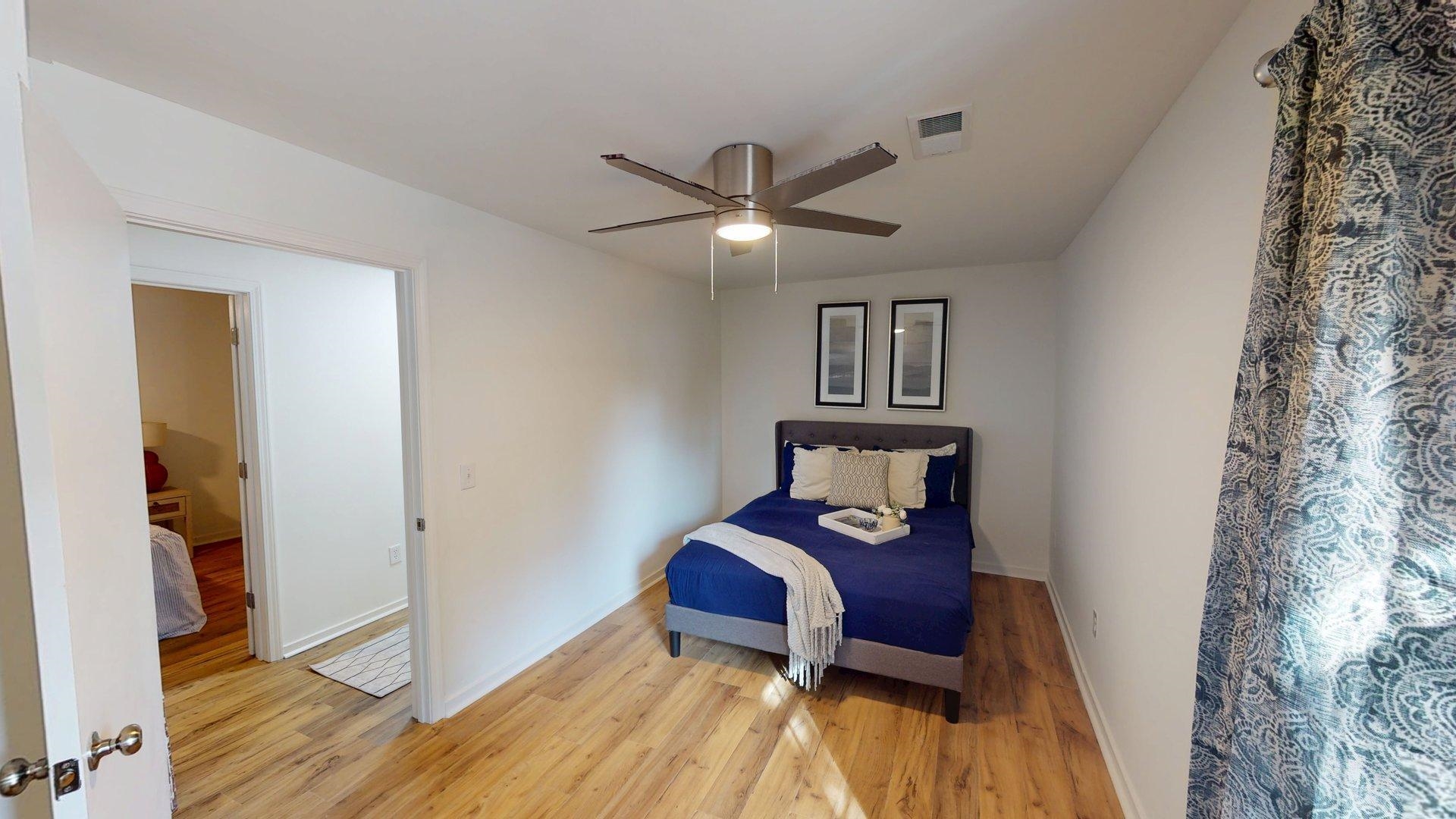 52 Cr 341 Road Iuka, MS 38852 - Photo 16 of 28 a bedroom with a bed and a chandelier