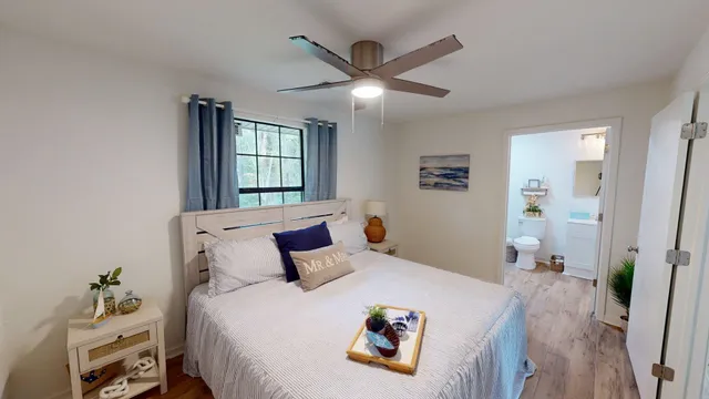 a bedroom with a bed and window