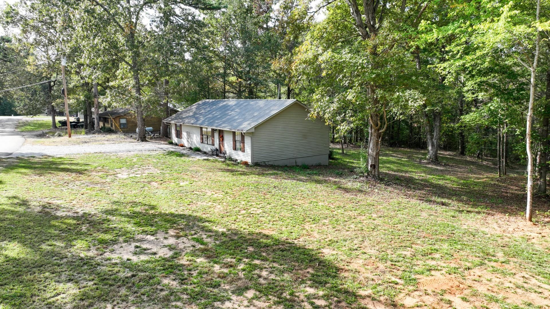 52 Cr 341 Road Iuka, MS 38852 - Photo 23 of 28 a view of a house with a yard and sitting area
