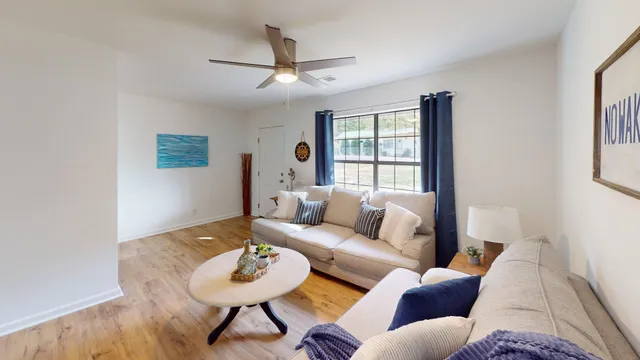 a living room with furniture and a window