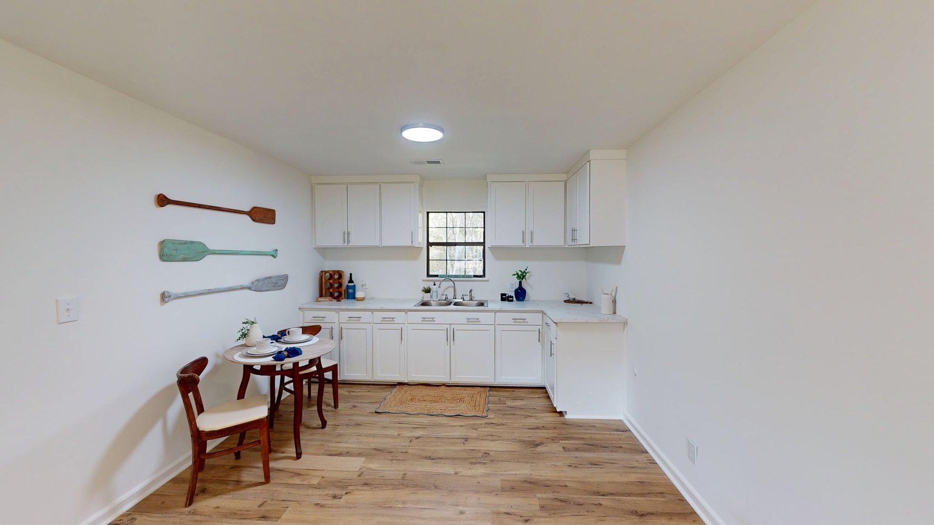 52 Cr 341 Road Iuka, MS 38852 - Photo 8 of 28 a kitchen with granite countertop a sink cabinets and appliances