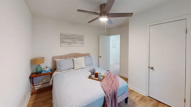 a bed room with a bed and a chandelier