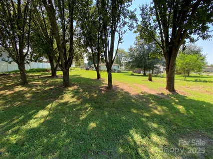 a view of swimming pool with a garden