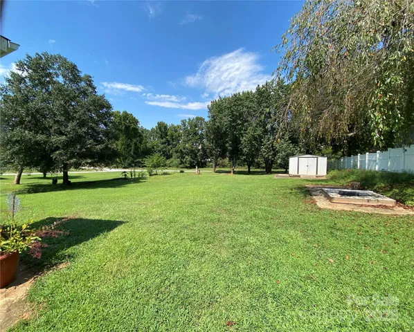 a kitchen with a sink a refrigerator and window