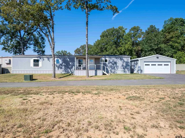 a view of a swimming pool with a chair