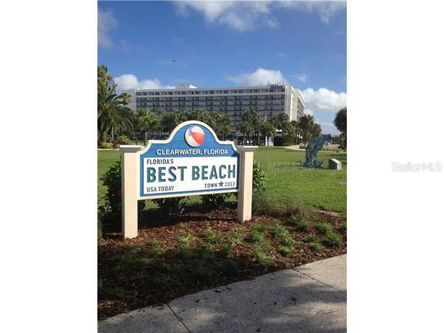 a view of a swimming pool with a lounge chair