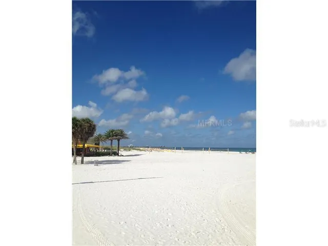a view of a house with garden space and sitting area