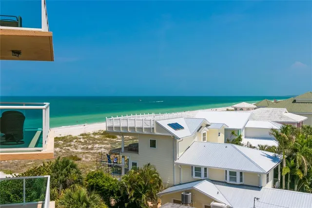 a aerial view of a house with a yard