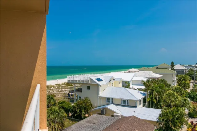 a kitchen with stainless steel appliances a refrigerator and cabinets