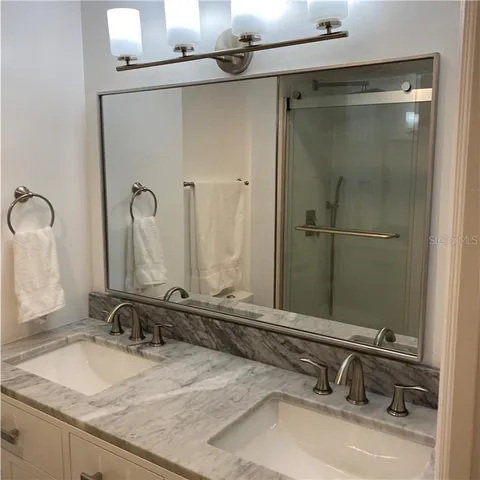 a bathroom with a granite countertop toilet