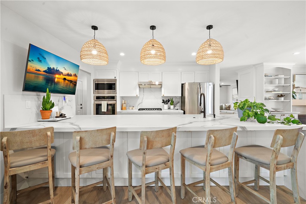 8741 La Roca Avenue Fountain Valley, CA 92708 - Photo 18 of 50 Beautiful quartz kitchen with long breakfast bar