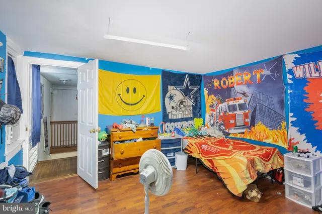 a room with toys and a wooden floor