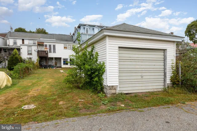 a front view of a house with a big yard