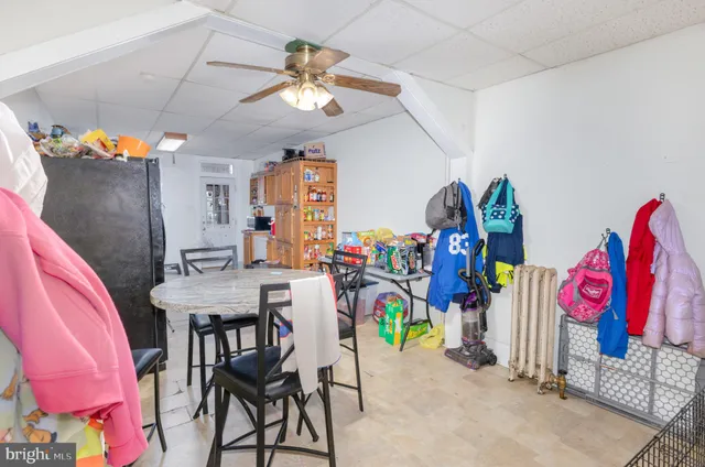 a view of a dining room with furniture and entryway