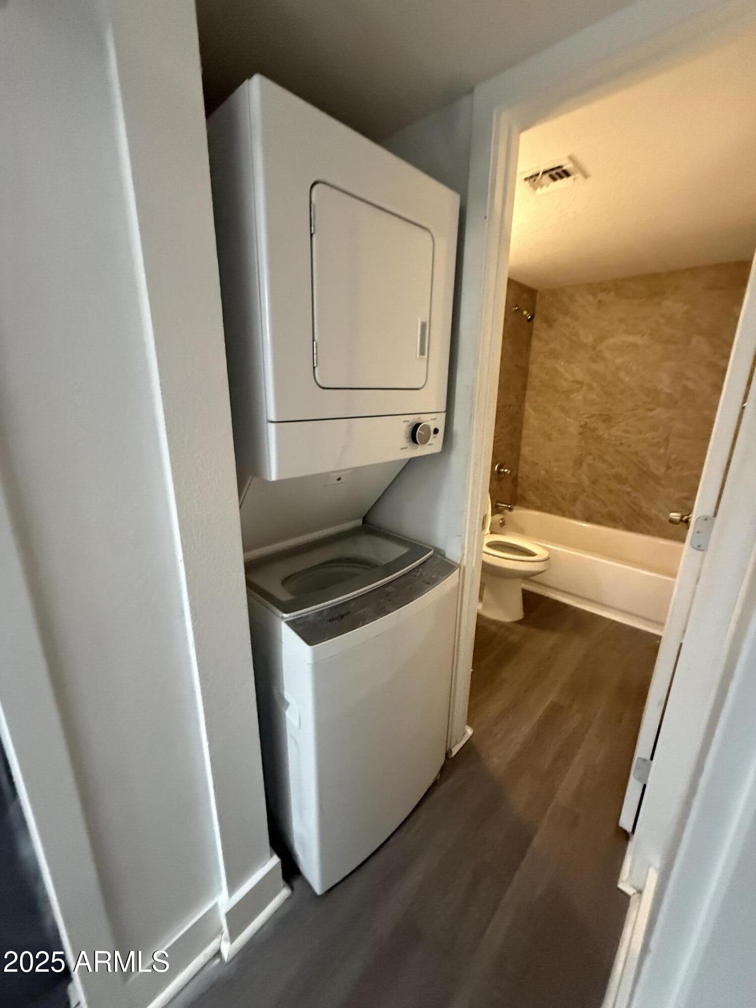 18202 Cave Creek Road, Unit 157 Phoenix, AZ 85032 - Photo 7 of 11 a utility room with wooden floor washer and dryer