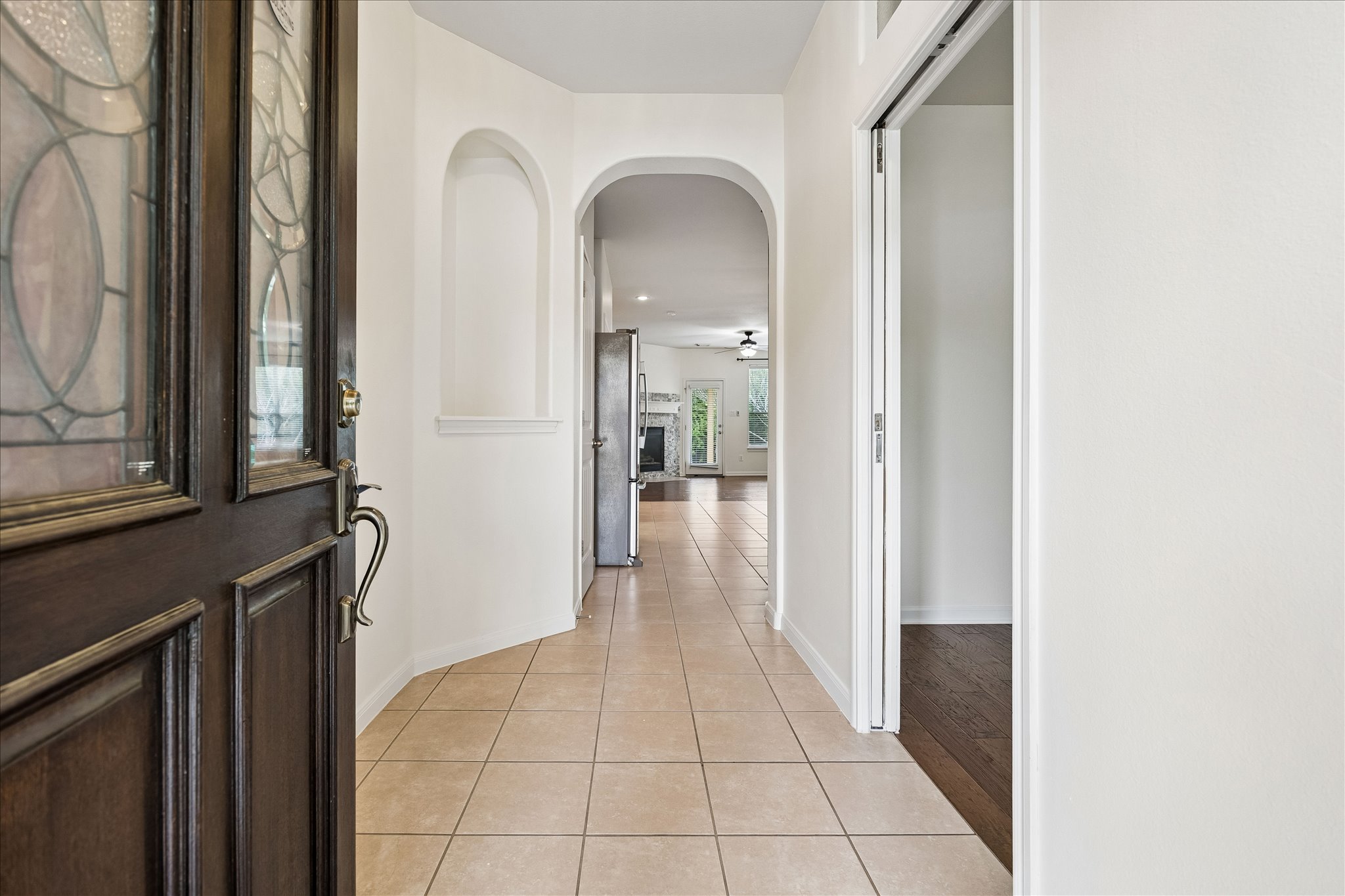 206 Saddle Ridge Drive Cedar Park, TX 78613 - Photo 2 of 20 a view of a hallway with wooden floor and a living room