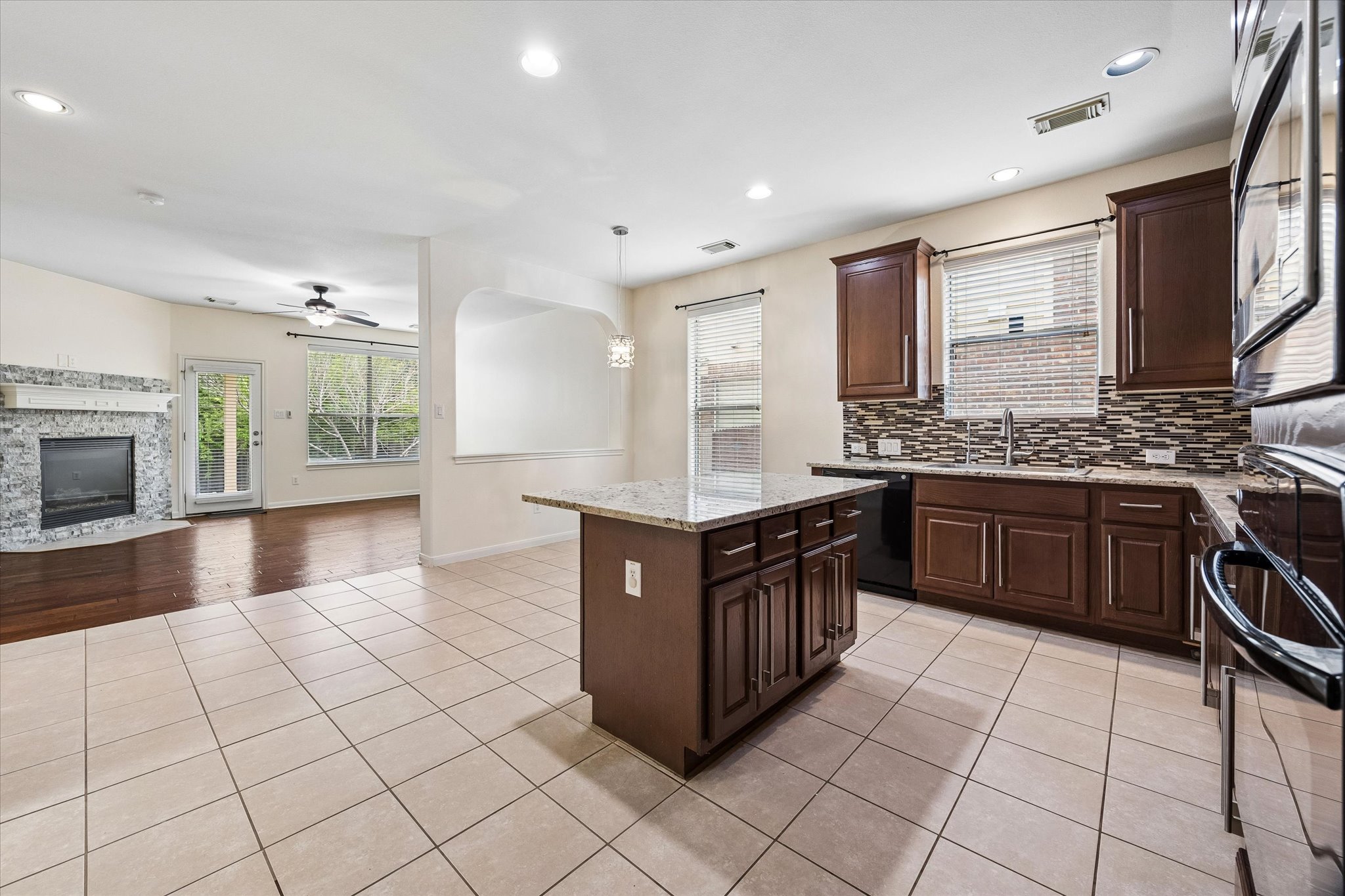 206 Saddle Ridge Drive Cedar Park, TX 78613 - Photo 4 of 20 a kitchen with stainless steel appliances granite countertop a stove a sink and a refrigerator