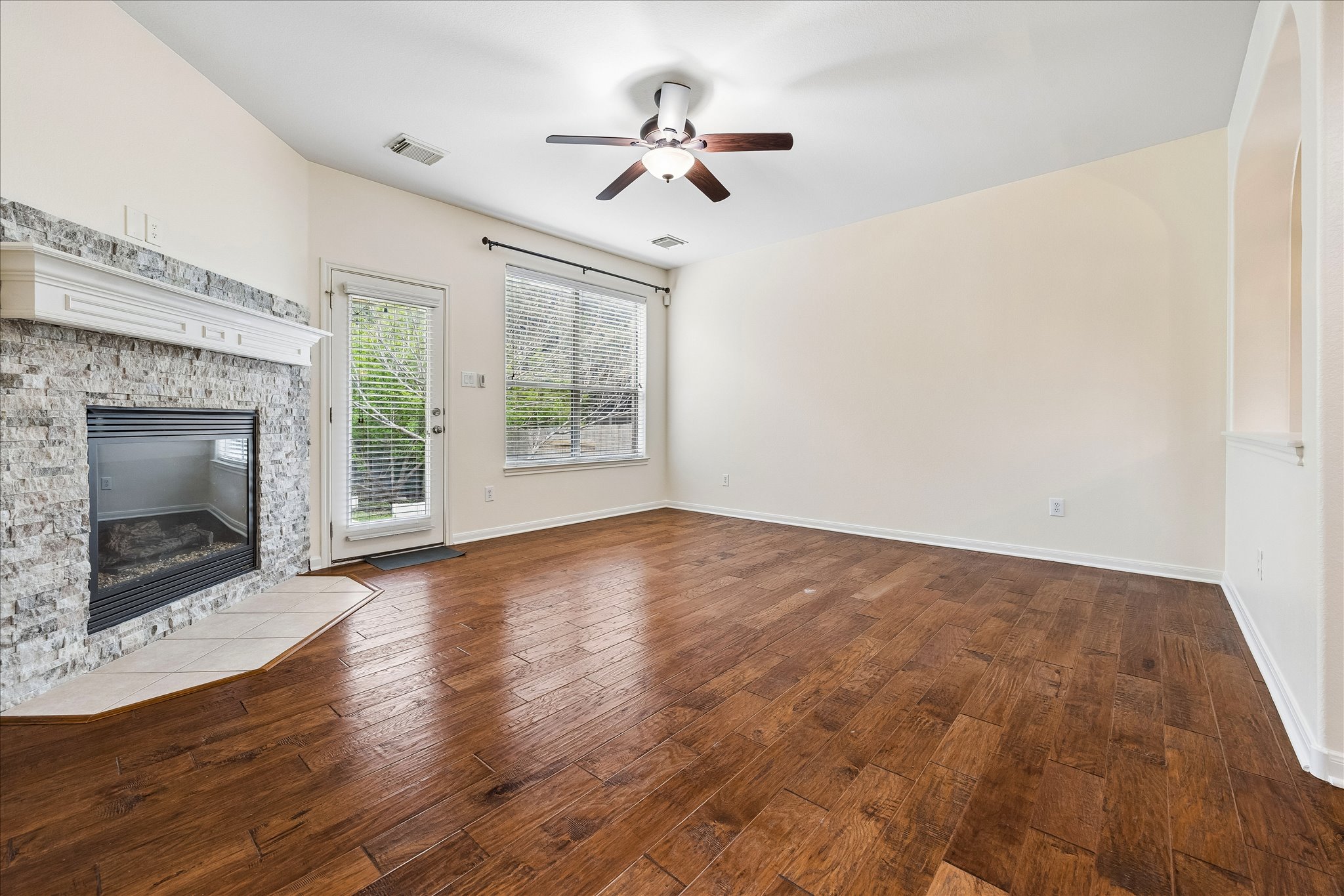 206 Saddle Ridge Drive Cedar Park, TX 78613 - Photo 7 of 20 a view of an empty room with a fireplace and a window