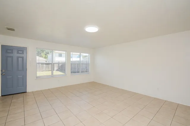 an empty room with windows