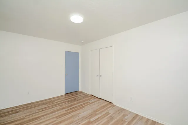 a swimming pool with wooden fence