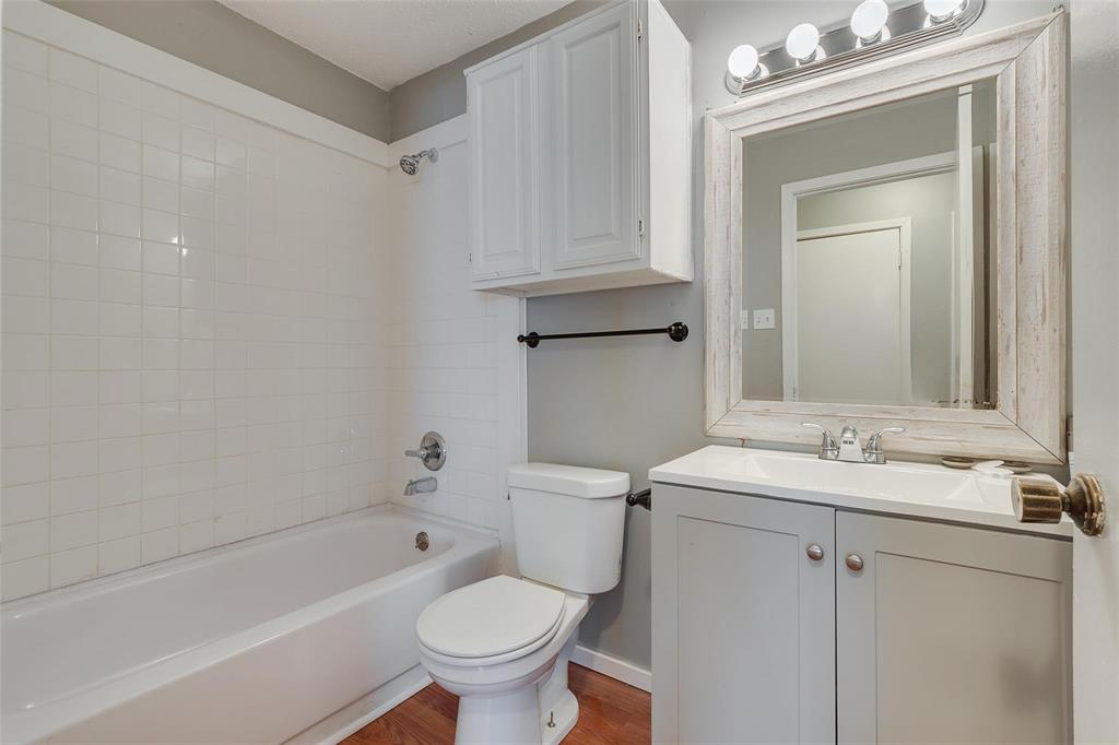 3959 North Garland Avenue, Unit 1 Garland, TX 75040 - Photo 2 of 11 a bathroom with a sink toilet and shower
