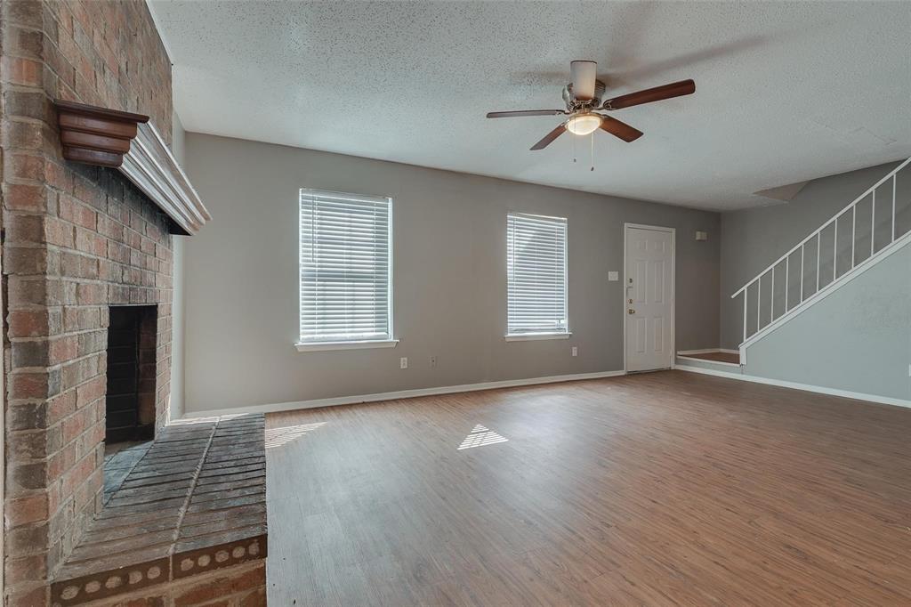 3959 North Garland Avenue, Unit 1 Garland, TX 75040 - Photo 9 of 11 a view of an empty room with a window and wooden floor