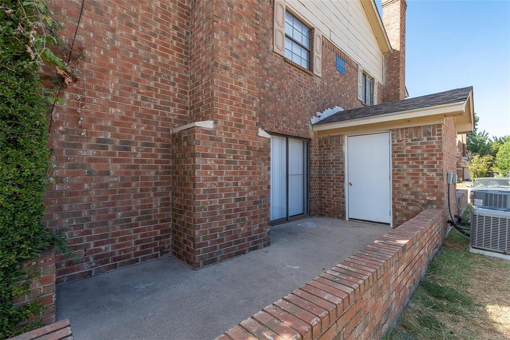 3959 North Garland Avenue, Unit 1 Garland, TX 75040 - Photo 10 of 11 a view of a brick house with many windows