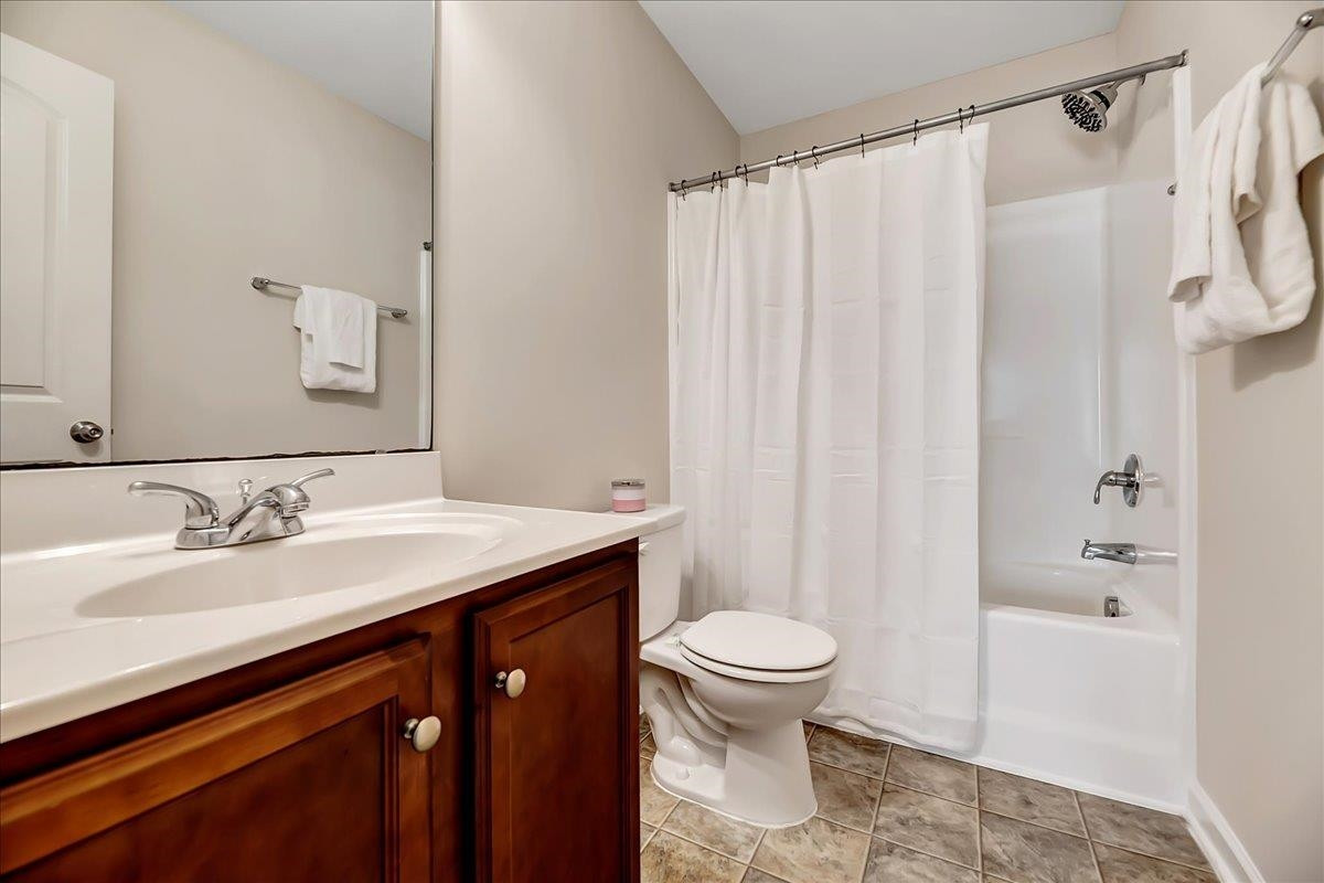 1621 Brownairs Lane Raleigh, NC 27610 - Photo 12 of 29 a bathroom with a granite countertop sink toilet and shower