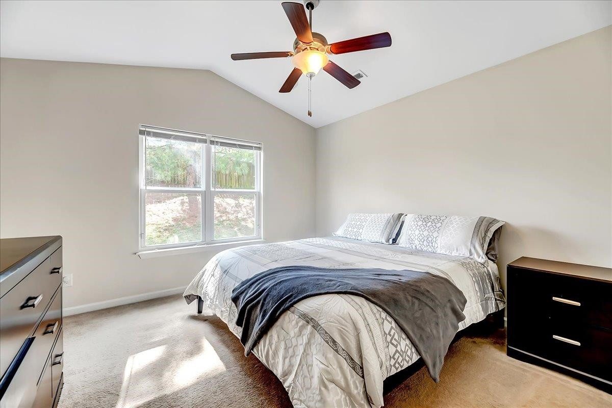 1621 Brownairs Lane Raleigh, NC 27610 - Photo 14 of 29 a bedroom with a bed and a window